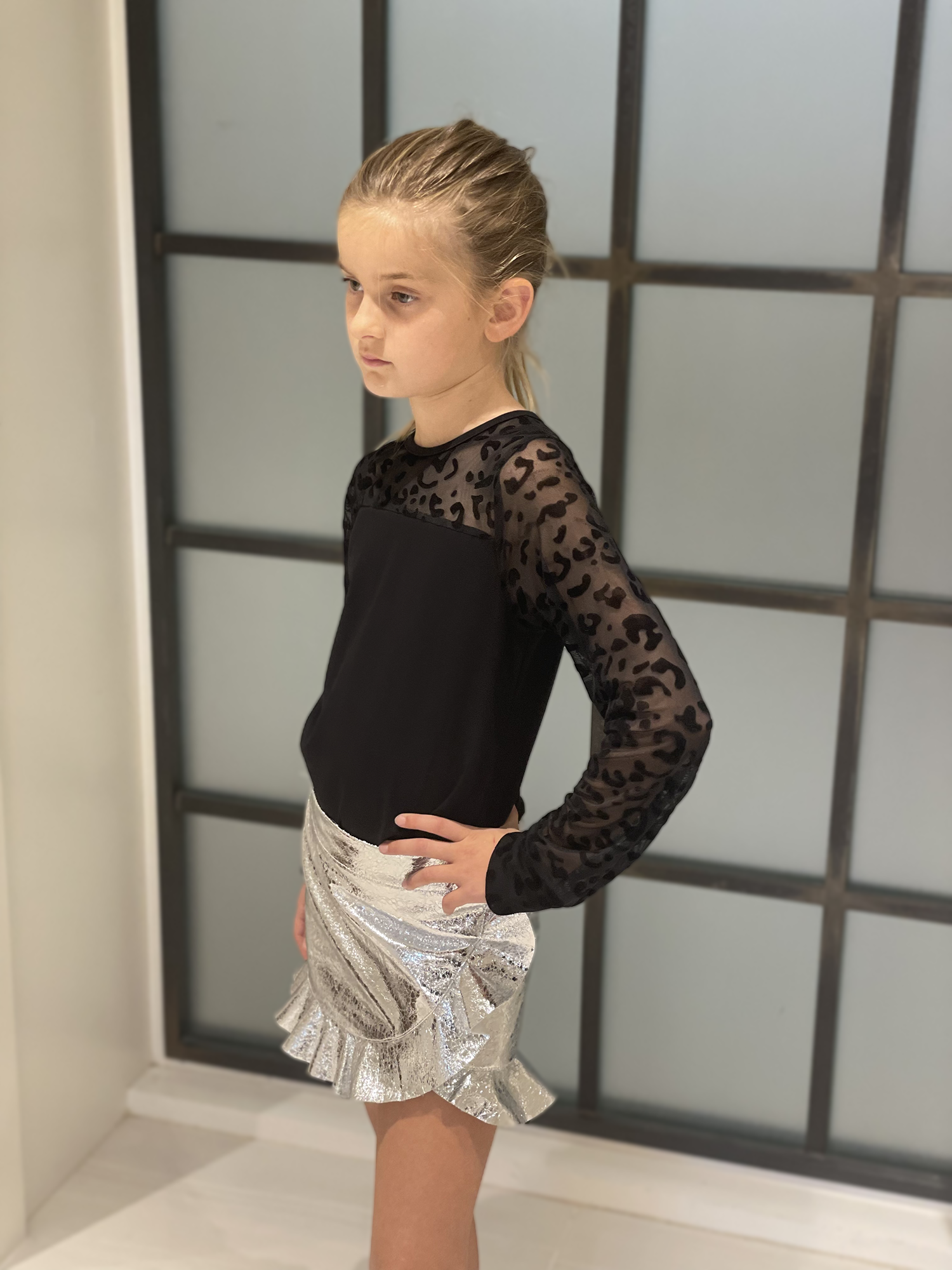 Black jersey top with leopard sleeves